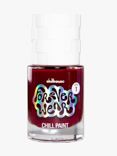 Bottle of Chillhouse Forever Wear Nail Polish in "Natty Wine" with white cap on light gray background